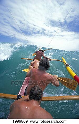 Close-Up Back View Local Men Riding Wave In Outrigger Canoe View Large Photo Image Stock Photo - Close-Up Back View Local Men Riding Wave In Outrigger Canoe. Fotosearch
