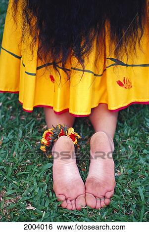 Close-Up Back View Of Woman Hula Dancer With Kupe'e On Ankle, Yellow Skirt Kneeling. View Large Photo Image Stock Photograph - Close-Up Back View Of Woman Hula Dancer With Kupe'e On Ankle, Yellow Skirt Kneeling.. Fotosearch