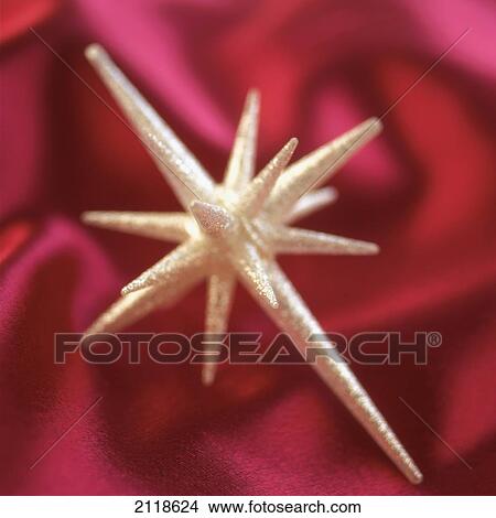 Picture - Close-Up Detail Of A Star-Shaped Christmas Ornament. Fotosearch