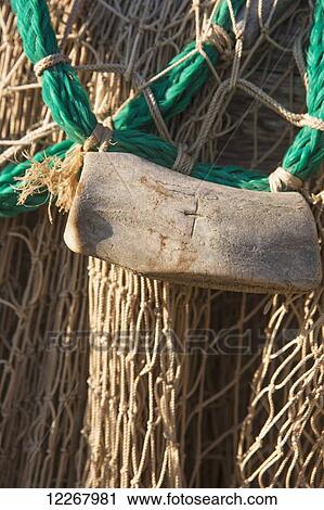 Close up of a fishing net and hand carved caribou antler fishing net weight, Shungnak, Arctic Alaska, Summer View Large Photo Image Stock Image - Close up of a fishing net and hand carved caribou antler fishing net weight, Shungnak, Arctic Alaska, Summer. Fotosearch