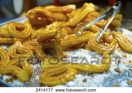 Close up of a fried dish and tongs; Barcelona, Spain View Large Photo Image Stock Photo - Close up of a fried dish and tongs; Barcelona, Spain. Fotosearch