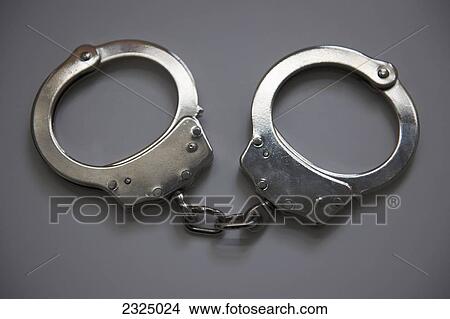 Close-up of a pair of handcuffs View Large Photo Image Picture - Close-up of a pair of handcuffs. Fotosearch