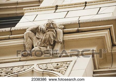 Close Up Of A Stone Sculture On The Side Of A Building; Toronto, Ontario, Canada View Large Photo Image Stock Photograph - Close Up Of A Stone Sculture On The Side Of A Building; Toronto, Ontario, Canada. Fotosearch