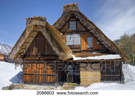 Stock Image - Close-Up Of A Traditional Japanese Village House With Thatched Roof In Winter; Shirakawa, Gifu, Japan. Fotosearch