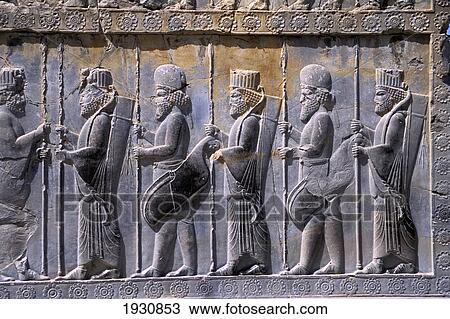 Stock Image - Close-Up Of Carvings On Monumental Door, Persepolis, Iran; Persepolis, Iran. Fotosearch
