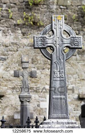 Close up of celtic cross in cemetery with stone wall in background; Limerick, County Limerick, Ireland View Large Photo Image Stock Photography - Close up of celtic cross in cemetery with stone wall in background; Limerick, County Limerick, Ireland. Fotosearch