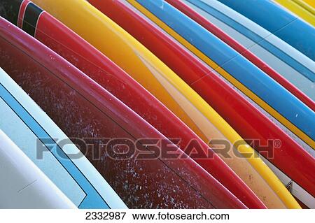 Close up of coloured surfboards lined up; Honolulu, Oahu, Hawaii, United States of America View Large Photo Image Stock Photo - Close up of coloured surfboards lined up; Honolulu, Oahu, Hawaii, United States of America. Fotosearch