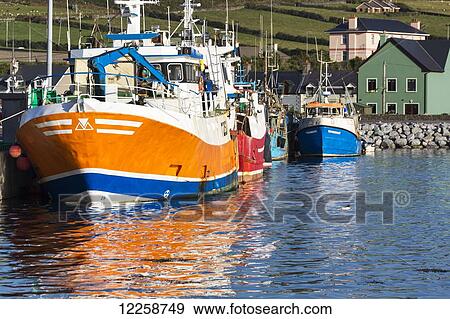 Close up of colourful fishing boats reflecting in the water; Dingle, County Kerry, Ireland View Large Photo Image Stock Photo - Close up of colourful fishing boats reflecting in the water; Dingle, County Kerry, Ireland. Fotosearch