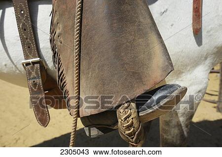 Stock Image - Close-Up Of Cowboy His Chaps And His Horse; Arizona Usa. Fotosearch