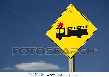 Close up of fire truck road sign with blue sky and cloud; Bragg Creek, Alberta, Canada View Large Photo Image Picture - Close up of fire truck road sign with blue sky and cloud; Bragg Creek, Alberta, Canada. Fotosearch