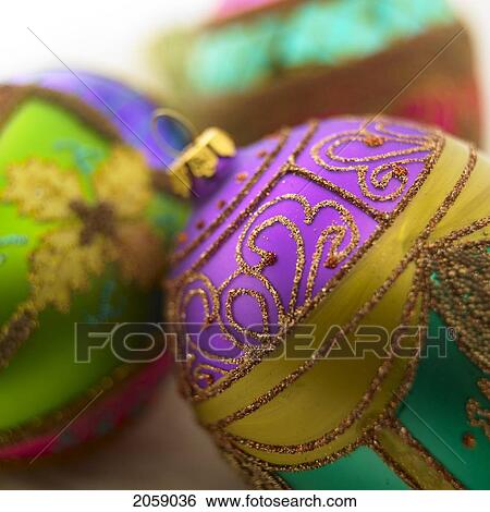 Stock Photograph - Close Up Of Green, Purple And Pink Christmas Ball Ornaments.. Fotosearch