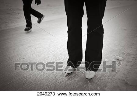 Stock Image - Close Up Of Ice Skating On The Assiniboine River Trail, World's Longest Naturally Frozen Ice Skating Trail, The Forks, Winnipeg, Manitoba. Fotosearch