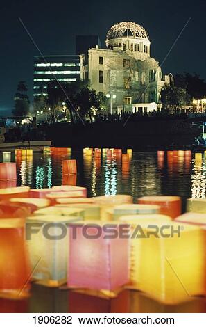 Stock Image - Close-Up Of Lanterns Placed On Montoyasu River, Peace Park, Hiroshima In A Buddhist Ceremony For Dead Souls Held On August 6Th, A-Bomb Dome Background, Japan. Fotosearch