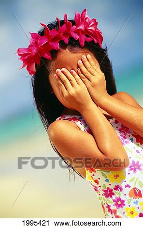 Close-Up Of Local Little Girl Covering Up Her Face, Wearing Pink Flower Haku View Large Photo Image Stock Image - Close-Up Of Local Little Girl Covering Up Her Face, Wearing Pink Flower Haku. Fotosearch