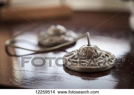 Picture - Close up of meditation cymbals at studio in Homer, Southcentral Alaska.. Fotosearch
