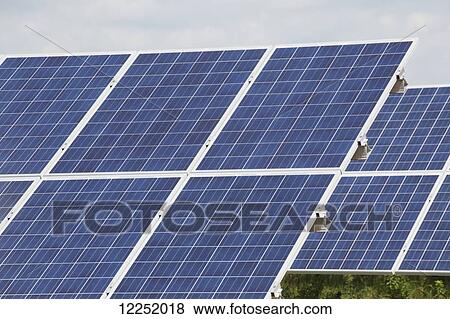 Close up of rows of solar panels in a solar farm; Port Colborne, Ontario, Canada View Large Photo Image Stock Photo - Close up of rows of solar panels in a solar farm; Port Colborne, Ontario, Canada. Fotosearch