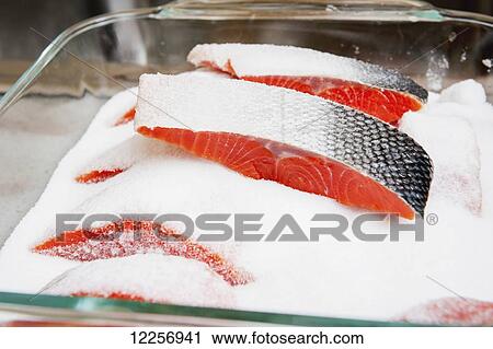 Close up of salmon strips covered with salt in preparation for smoking, Alaska View Large Photo Image Stock Image - Close up of salmon strips covered with salt in preparation for smoking, Alaska. Fotosearch