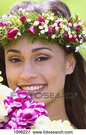 Close-Up Of Smiling Hawaiian Woman With Haku Lei And Foreground Flowers View Large Photo Image Stock Photo - Close-Up Of Smiling Hawaiian Woman With Haku Lei And Foreground Flowers. Fotosearch