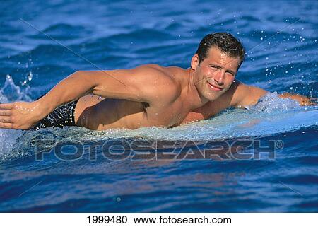Close-Up Of Surfer Paddling In Deep Blue Water View Large Photo Image Stock Image - Close-Up Of Surfer Paddling In Deep Blue Water. Fotosearch