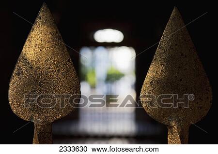 Stock Image - Close Up Of The Fences Decorated With Golden Spades At Casa De Pilatos; Seville, Andalusia, Spain. Fotosearch