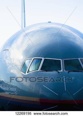 Stock Photography - Close up of the front of an airplane; Chicago, Illinois, United States of America. Fotosearch
