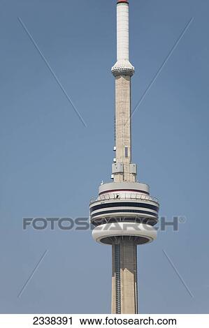 Stock Image - Close Up Of The Pod On Top Of The Cn Tower With Blue Sky; Toronto, Ontario, Canada. Fotosearch