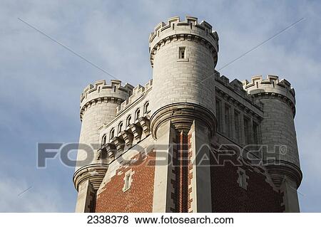 Stock Photo - Close Up Of The Top Of A Castle Tower With Blue Sky And Clouds; Toronto, Ontario, Canada. Fotosearch