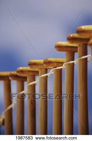Close-Up Of Tops Of Paddles Hanging In Row. View Large Photo Image Stock Image - Close-Up Of Tops Of Paddles Hanging In Row.. Fotosearch