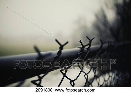 Stock Photo - Close-Up Of Twisted Wires On Steel Fence; Otterburn Park, Quebec, Canada. Fotosearch