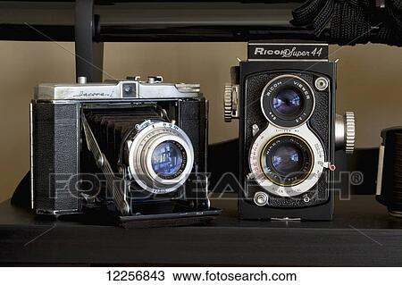 Close-up of two cameras View Large Photo Image Stock Image - Close-up of two cameras. Fotosearch