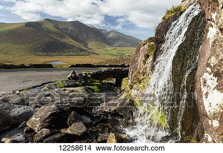 Close up of waterfalls with mountain in the background; Dingle, County Kerry, Ireland View Large Photo Image Picture - Close up of waterfalls with mountain in the background; Dingle, County Kerry, Ireland. Fotosearch