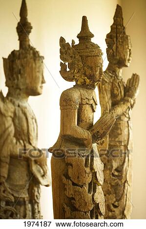 Close-Up On A Wooden Buddha Sculptures (Sepia Photograph). View Large Photo Image Stock Photo - Close-Up On A Wooden Buddha Sculptures (Sepia Photograph).. Fotosearch