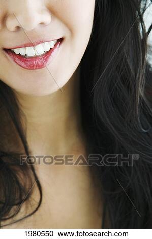 Stock Image - Close-Up On The Mouth Of A Beautiful Asian Woman.. Fotosearch