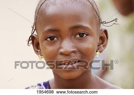 Close-up portrait of a girl in Segou, Mali View Large Photo Image Stock Photo - Close-up portrait of a girl in Segou, Mali. Fotosearch