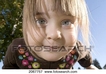 Close Up Portrait Of A Little Girl Outside On A Sunny Day View Large Photo Image Stock Photo - Close Up Portrait Of A Little Girl Outside On A Sunny Day. Fotosearch
