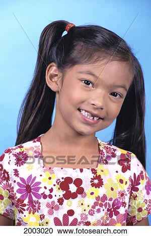 Close-Up Portrait Of Local Asian Girl With Pigtails, Smiling Studio Shot View Large Photo Image Stock Image - Close-Up Portrait Of Local Asian Girl With Pigtails, Smiling Studio Shot. Fotosearch