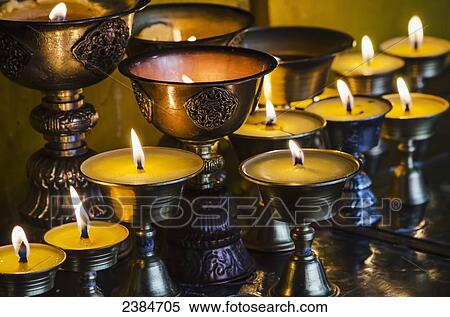 Close up view of candles and lamps at Buddhist temple, Longwu monastery; Tibet, China View Large Photo Image Stock Photography - Close up view of candles and lamps at Buddhist temple, Longwu monastery; Tibet, China. Fotosearch