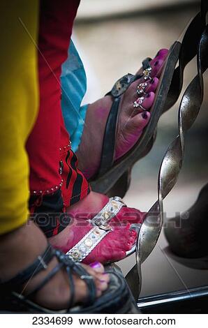 Stock Photo - Close-Up View Of Female Feet In Sandals; Varanasi, India. Fotosearch