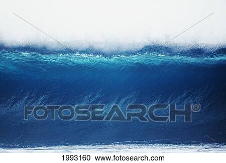 Stock Image - Close-Up View Of Wave Cresting From The Front.. Fotosearch
