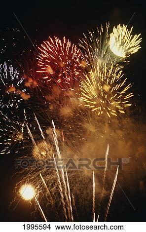 Picture - Closeup Of Fireworks Exploding In The Night Sky.. Fotosearch