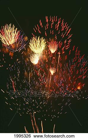 Stock Photograph - Closeup Of Fireworks Exploding In The Night Sky.. Fotosearch