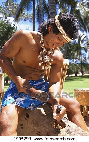 Closeup Of Local Man With Shell Haku And Necklace, Making Pau Drum View Large Photo Image Stock Photo - Closeup Of Local Man With Shell Haku And Necklace, Making Pau Drum. Fotosearch