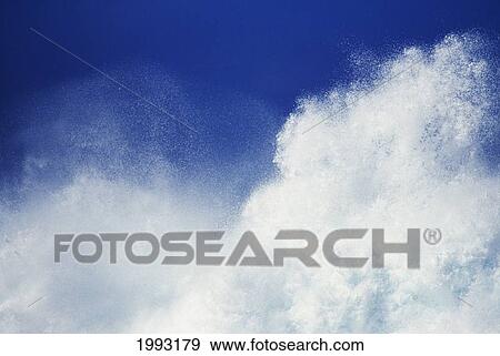 Stock Photo - Closeup Of White Wash From Huge Crashing Wave In Blue Sky.. Fotosearch