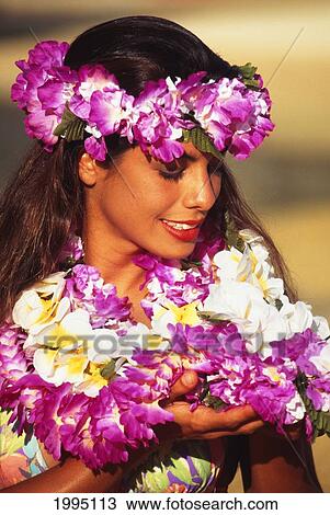 Stock Image - Closeup Of Young Woman With Many Colorful Leis.. Fotosearch