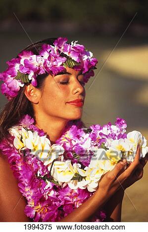 Stock Photography - Closeup Of Young Woman With Many Colorful Leis, Eyes Closed. Fotosearch