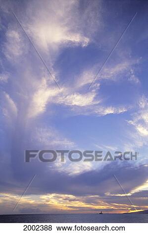 Cloud Formations In Blue Sky At Dusk, Yellow Along Horizon Over Ocean View Large Photo Image Stock Photo - Cloud Formations In Blue Sky At Dusk, Yellow Along Horizon Over Ocean. Fotosearch