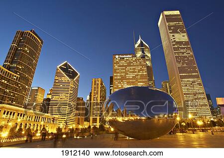 Stock Image - Cloud Gate (The Bean) Sculpture In Front Of Skyscrapers At Night, Chicago, Illinois, Usa. Fotosearch