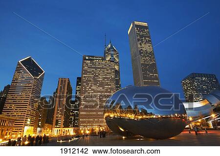 Stock Image - Cloud Gate (The Bean) Sculpture In Front Of Skyscrapers At Night, Chicago, Illinois, Usa. Fotosearch