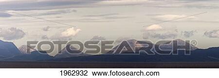 Stock Image - Clouds Above A Mountain Range; Argyll, Scotland. Fotosearch