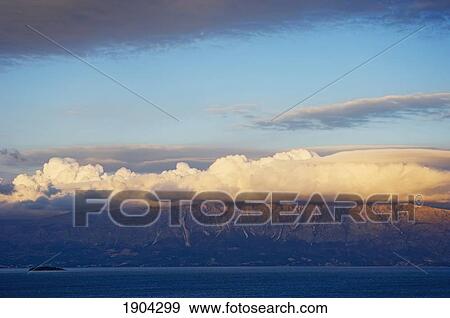 Stock Photo - Clouds Above Cliffs Of Ioninan Islands, Ioninan Islands, Greece. Fotosearch